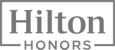 The image shows the logo for Hilton Honors, a loyalty program by Hilton Hotels.